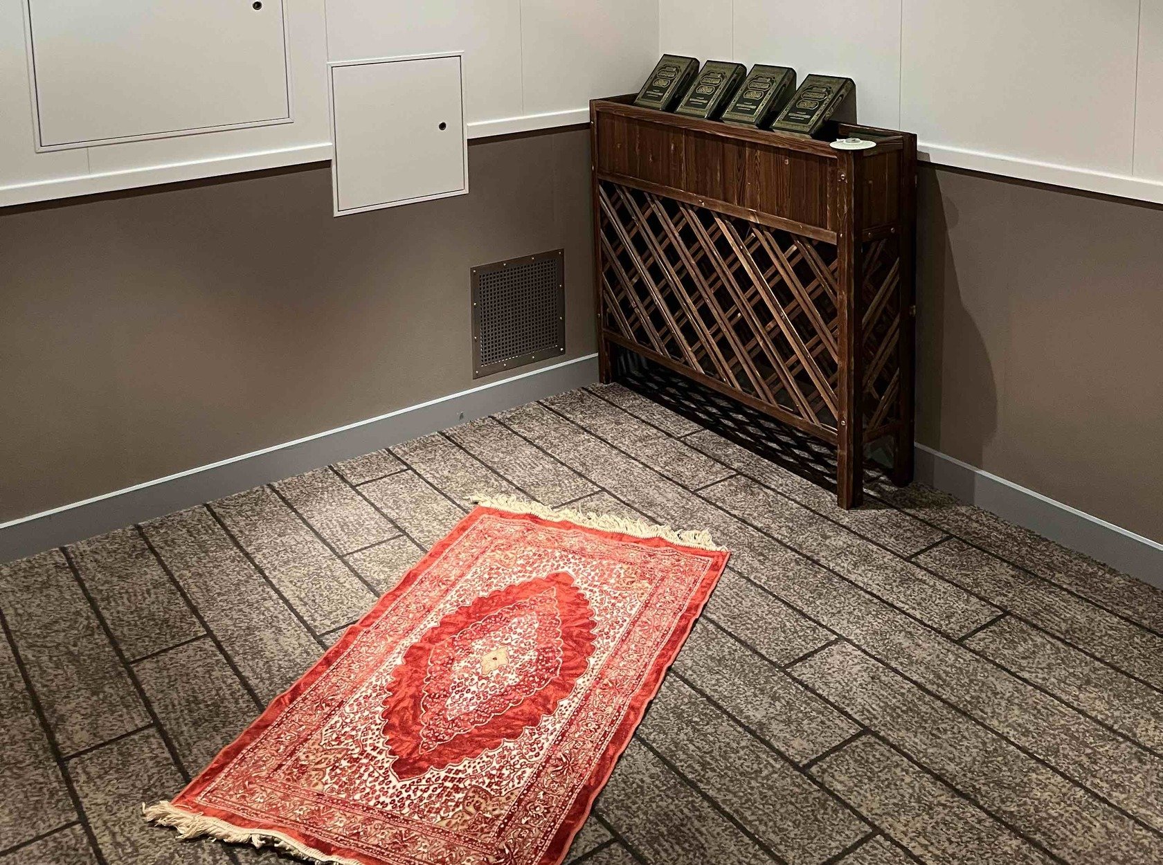 Prayer facilities with prayer mat, Quran and digital compass for Qiblah